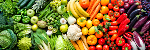 An overhead shot of a rainbow assortment of fresh fruit and vegetables