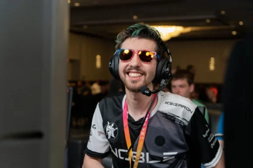 27-year-old cancer survivor, Steven Eisner, wearing headphones and sunglasses and smiling widely