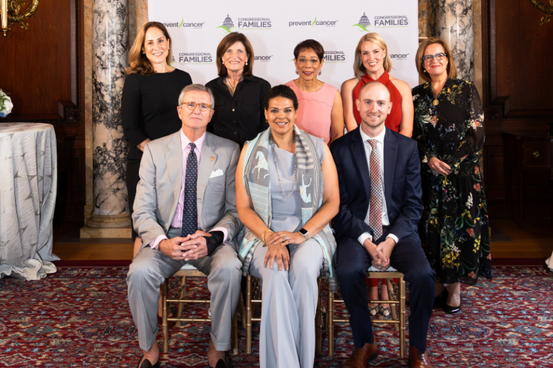 The awardees and presenters pose in front of a Congressional Families backdrop in the Library of Congress