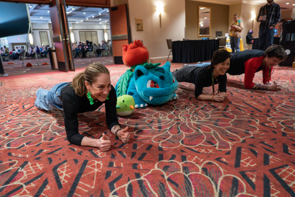 Jody and Shelby from the Prevent Cancer Foundation do a plank challenge with an Awesome Games Done Quick participant