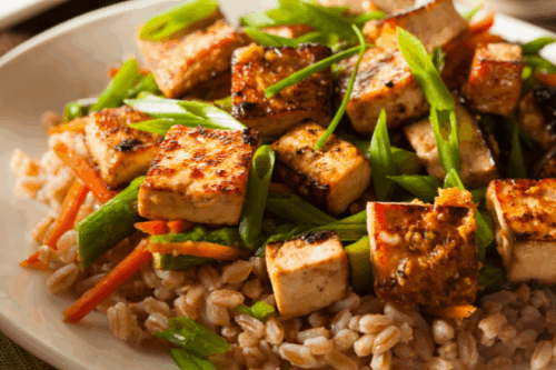 Roasted tofu and scallions served with farro.