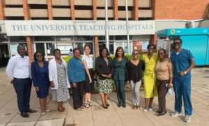 Project director Dr. Toma Omofoye stands with with her team in Zambia.