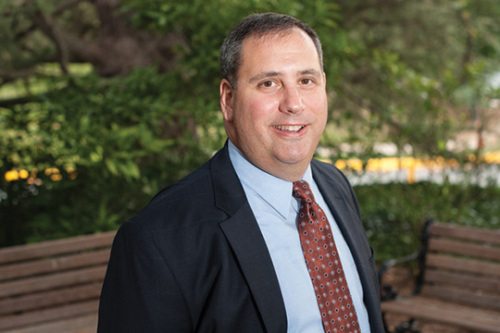 Three-quarter view headshot of Jon Nevett