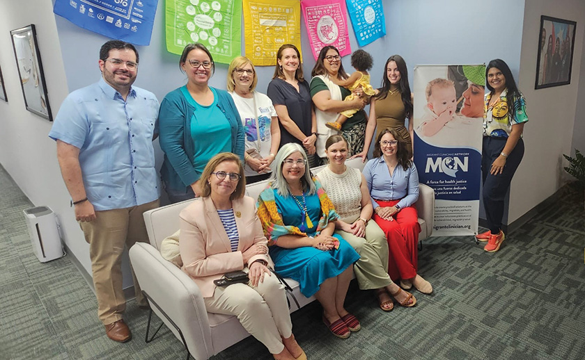 A large group of people posing for a photo at a medical clinic in Puerto Rico